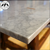 Tavolo con piano di marmo